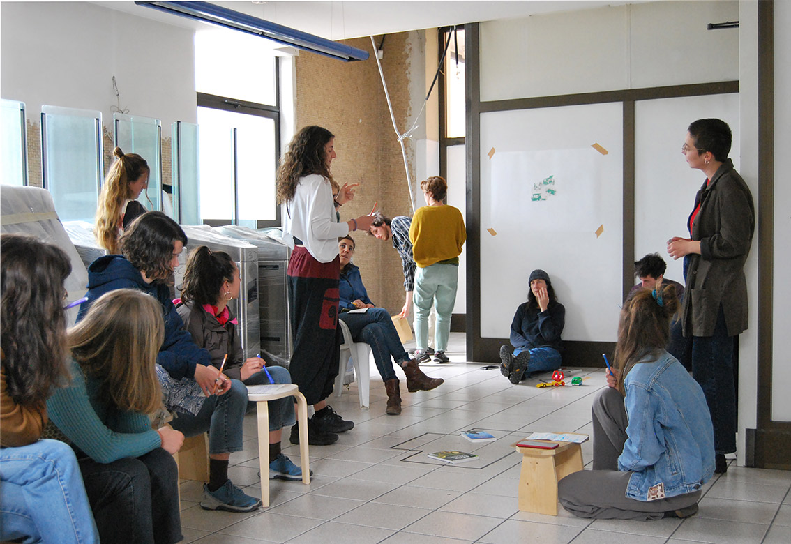 A group of people listening to a participant expressing her ideas on the activities that could take place in the S4T Biodiversity Kiosk.