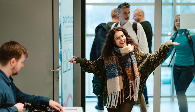 Happy participant arriving at a Peer Review 
