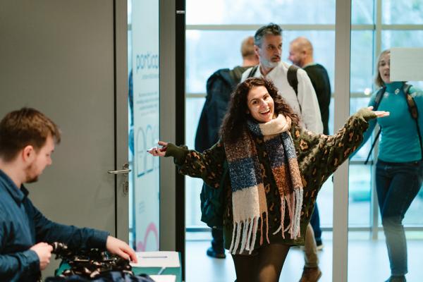Happy participant arriving at a Peer Review