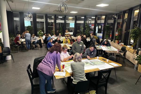Residents designing their communal gardens at different tables